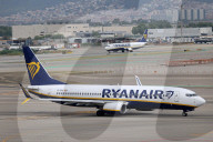 Diverse aircraft on the takeoff runway at Barcelon aAirport