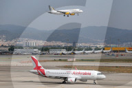 Diverse aircraft on the takeoff runway at Barcelon aAirport