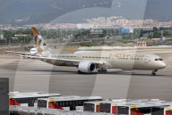 Diverse aircraft on the takeoff runway at Barcelona Airport