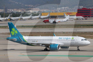 Diverse aircraft on the takeoff runway at Barcelona Airport