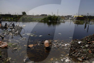 Partial Canal Overflow In La Ciénega In Tláhuac, Mexico City, Causing Serious Damage To Homes