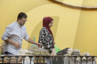 Members Of The Abed Family, Refugees From Palestine, Offer Authentic Palestinian Food For Sale In Mexico City