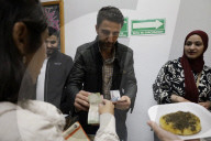 Members Of The Abed Family, Refugees From Palestine, Offer Authentic Palestinian Food For Sale In Mexico City