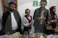 Members Of The Abed Family, Refugees From Palestine, Offer Authentic Palestinian Food For Sale In Mexico City