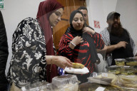 Members Of The Abed Family, Refugees From Palestine, Offer Authentic Palestinian Food For Sale In Mexico City
