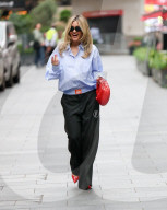 Pussycat Doll Ashley Roberts makes a stylish appearance at Heart radio wearing a blue shirt and trousers and red heels