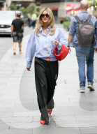 Pussycat Doll Ashley Roberts makes a stylish appearance at Heart radio wearing a blue shirt and trousers and red heels