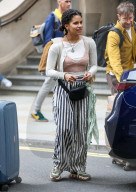 Actress Zazie Beetz shows off her unique style with underwear on full display and striped trousers