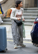 Actress Zazie Beetz shows off her unique style with underwear on full display and striped trousers