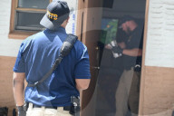 NYPD Police Officers Maintain A High Police Presence And Guard The Scene Where A 60-year-old Man Was Found Dead After Sustaining Trauma To The Head Inside Of A Motel Room At The Deegan Motel Within The Confines Of The 50 Precinct