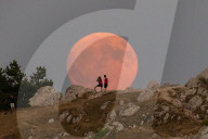 Sturgeon Full Moon Rising Behind Rocca Calascio, Italy