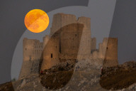 Sturgeon Full Moon Rising Behind Rocca Calascio, Italy