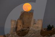 Sturgeon Full Moon Rising Behind Rocca Calascio, Italy