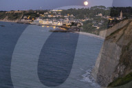 Sturgeon Full Moon Rises Over Normandy