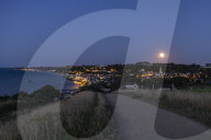 Sturgeon Full Moon Rises Over Normandy
