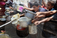 Palestinians Wait For Free Food From Food Distribution Center In Gaza City