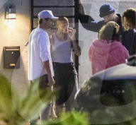 Justin Bieber Chain Smokes with Friends While Hailey Waits Inside Coucou Restaurant