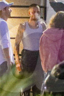 Justin Bieber Chain Smokes with Friends While Hailey Waits Inside Coucou Restaurant