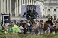 Rally Held Outside U.S. Capitol In Solidarity With Epstein Victims
