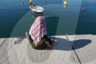 Person With Keffiyeh At Port Of Trieste