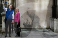 Shadow of removed Bansky grafitti amplifies it's political message