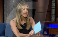 Aniston shows puppy love