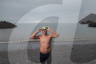 Iím here to help people Ö that gives me a superpowerí: one manís challenge to swim 10 Swiss lakes.