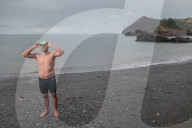 Iím here to help people Ö that gives me a superpowerí: one manís challenge to swim 10 Swiss lakes.