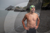 Iím here to help people Ö that gives me a superpowerí: one manís challenge to swim 10 Swiss lakes.