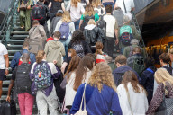Travelers With Luggage At Dutch Railway Station