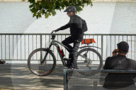 Man Talking On His Smartphone By River Rhine