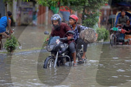 Dhaka Residents Suffer In Waterlogging