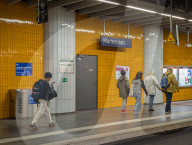 Young Man Using Smartphone During Walking At Station