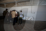 Gaza morgue workers recover bodies of Palestinians returned by Israel