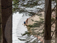 Couple By The Shore Of Lake