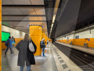 Commuters Wait On The Platform Of Marienplatz S-Bahn Station In Munich