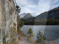 Couple Hikes Scenic Trail Above Lake Blindsee With Zugspitze Massif View