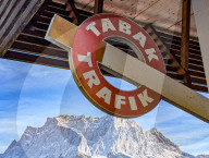 Tabak Trafik Store Sign With Zugspitze Mountain Backdrop In Tyrol