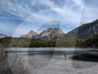Majestic Zugspitze Massif Overlooking Lake Blindsee With Autumn Forest In Tyrol