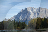 Lake Weissensee And The Snowy Zugspitze Massif In The Tyrolean Alps