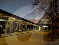 Commuters Wait At The Bus Terminal Of Klinikum Grosshadern Metro Station In The Evening