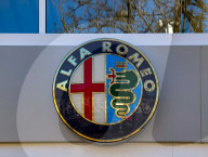 Close-up Of The Alfa Romeo Logo On A Dealership Building