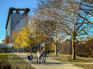People Walk Towards The LMU Klinikum Grosshadern Hospital Entrance