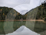 Emerald Green Lake Mittersee With Forest Reflection And Wetterstein Mountains Backdrop