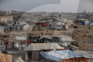 Palestinians returning to Jabalia buildings reduced to rubble
