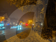 People On Street In Evening Mist