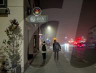 People On Street In Evening Mist