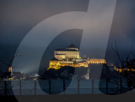 Kufstein Fortress And Austrian Mountain Peaks Illuminated At Night