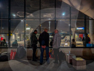Travelers Waiting At Munich Central Bus Station At Night