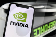 NVIDIA Logo Displayed On Smartphone With GeForce GPU Cooling Fan
